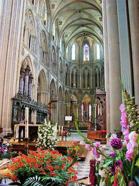 Original home to the Bayeux Tapestry, the Bayeux Cathedral is ablaze with color. Photo: WikiMedia.org.