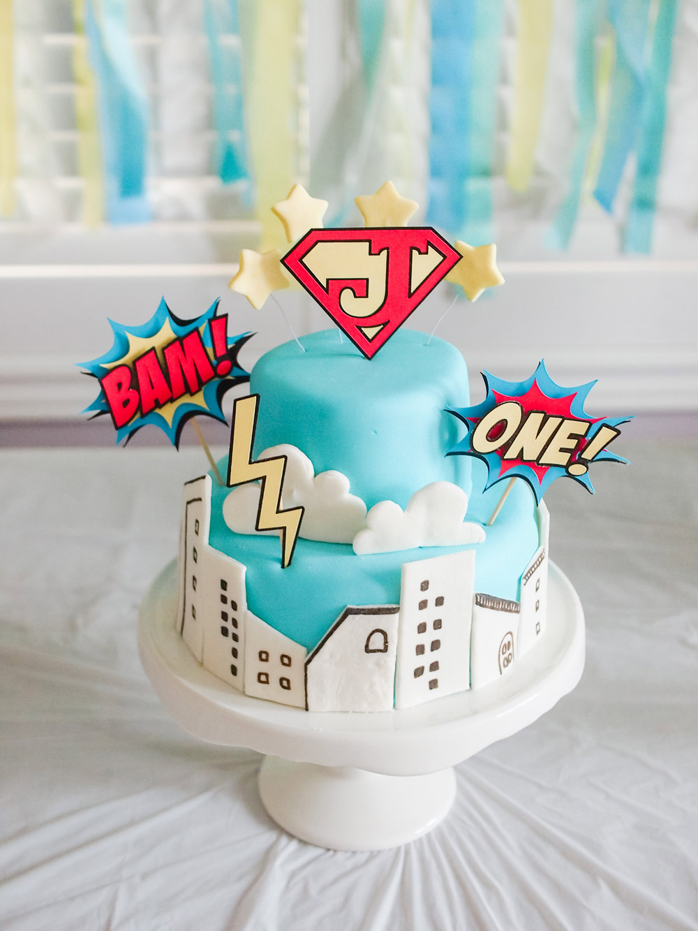 DIY Superhero Cake with marshmallow fondant and handmade cake toppers