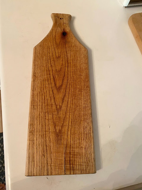 Photo of a garage sale cutting board.