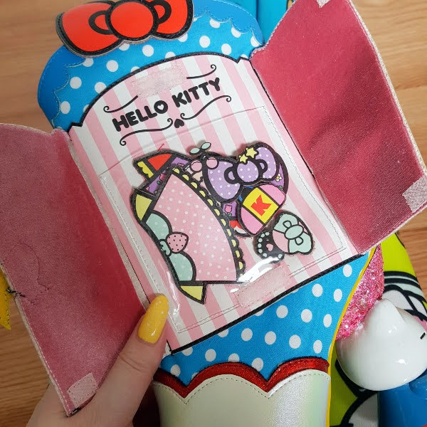 open wardrobe on side of ankle boot with Hello Kitty clothes inside