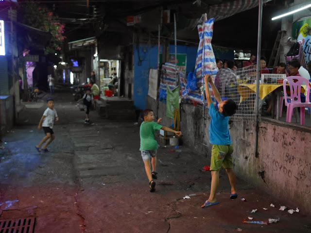 paper ball bounces off the hands of a boy in Zhuhai, China