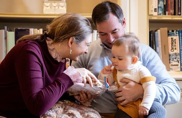 Prince Guillaume, Princess Stephanie and Prince Charles. Boden and Jacadi Paris. Burgundy sweater and gold earrings