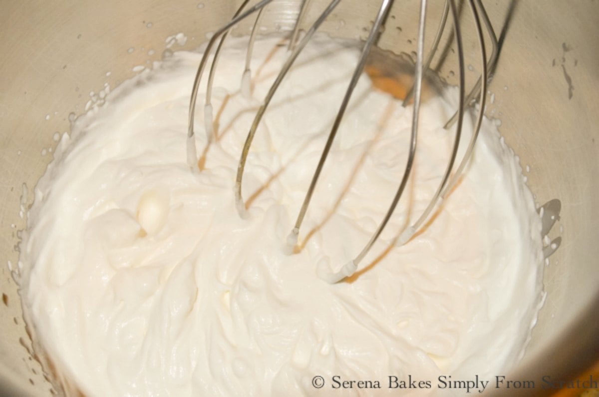 Beaten Whipped Cream in a mixing bowl.