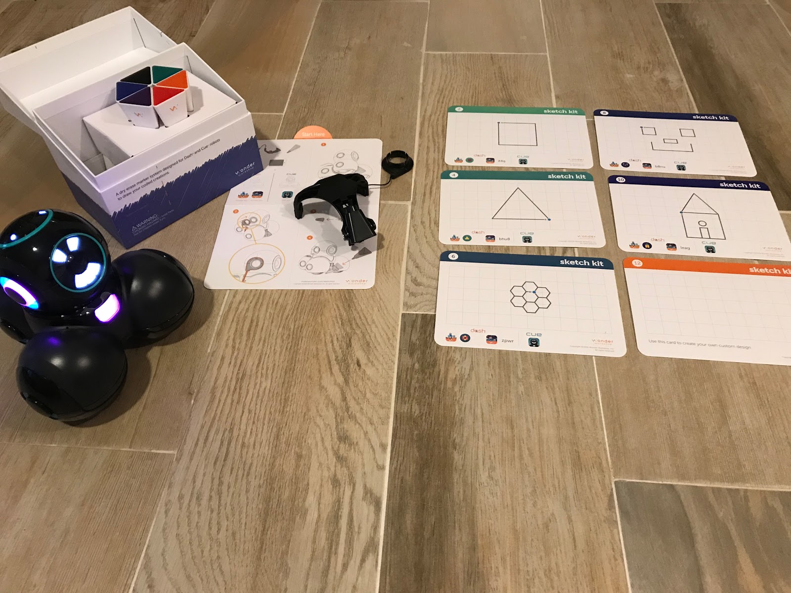 Coding and Sketching with Cue the Robot