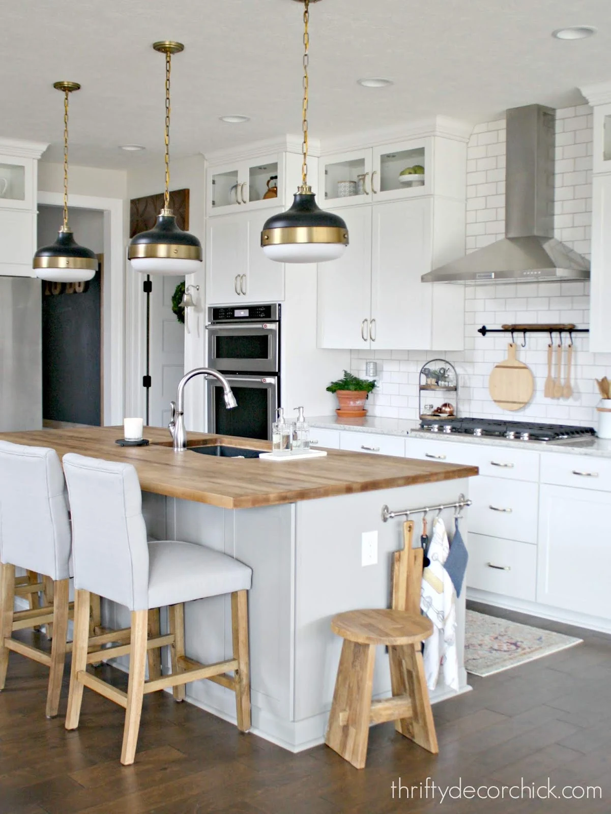 Light gray kitchen island white cabinets