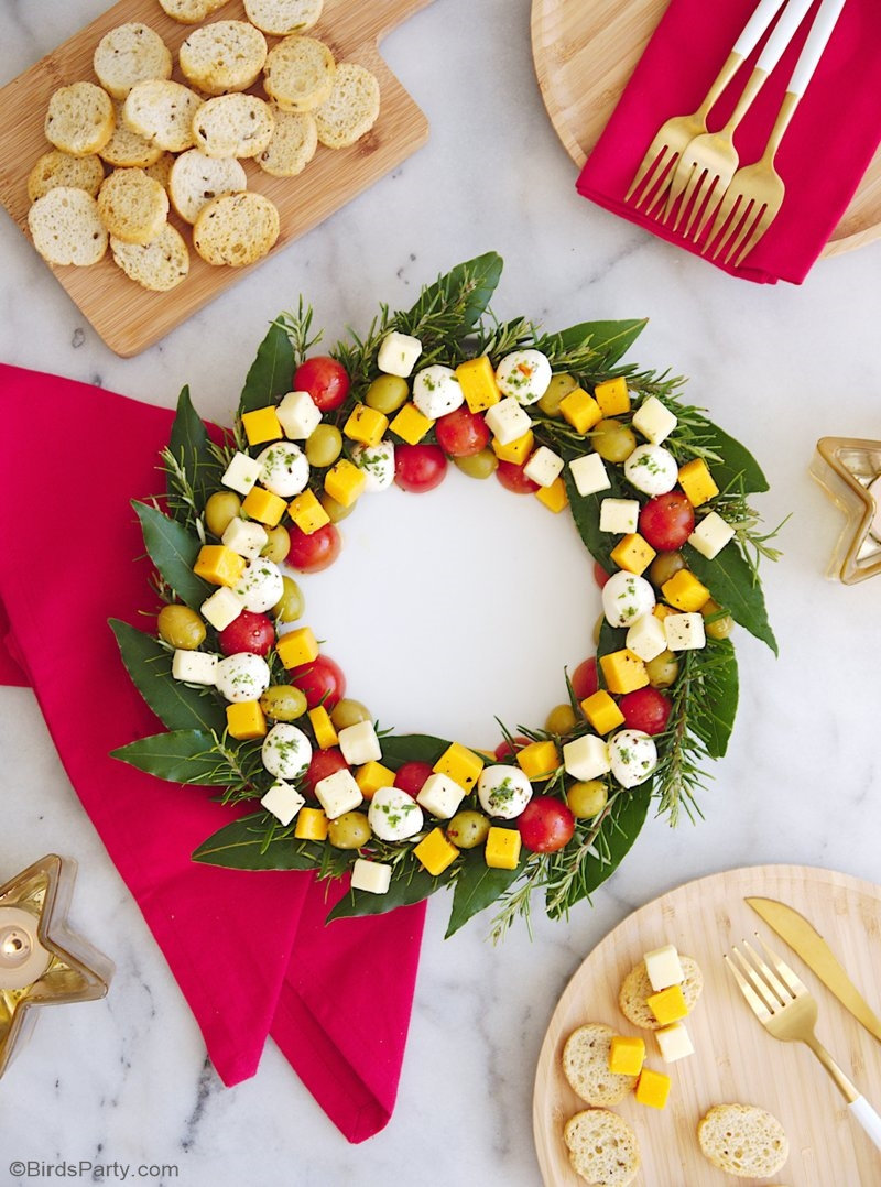 Christmas Wreath Cheese Platter Appetizer - an easy to assemble cheese board recipe that is very festive and perfect for holiday parties! by BirdsParty.com @birdsparty #holidaywreath #christmaswreath #cheesewreath #cheeseboard #cheeseplatter #holidaycheesewreath #christmascheesewreath #christmasappetizer #holidayappetizer #holidayrecipe #cheesewreathappetizer