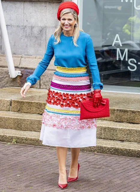 Queen Maxima wore a colourful midi skirt from Claes Iversen Haute Couture Spring Summer 2017 collection. Blue silk blouse