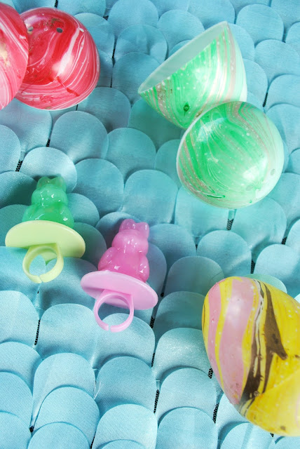 Party favors don't have to be expensive. Bunny ring pops, lip balms, nail polish are all great ideas. FizzyParty.com 