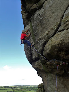 Dave Hinton climbing "Western Front" at Almscliffe.