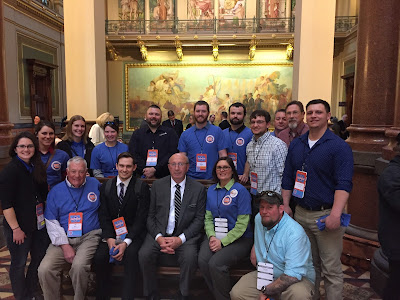 A group of conservation professionals at the state capitol