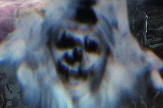 The ghostly figures are NOT friendly. Ghostly face.