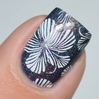 floral stamping over navy nail polish