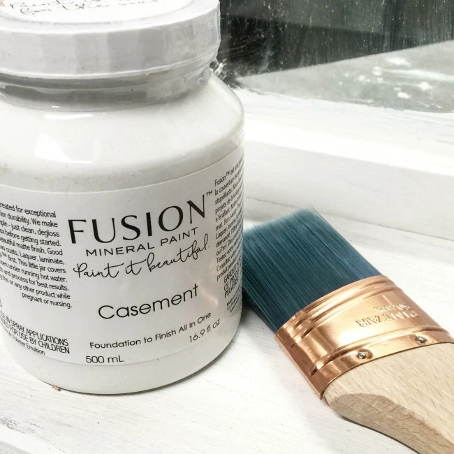 fusion mineral paint in casement with a brush