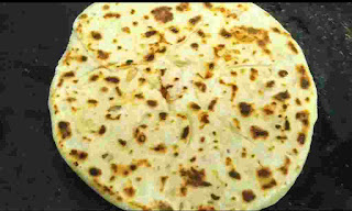 Onion kulcha Crisp golden brown onion kulcha on tawa or pan
