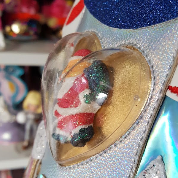 heart shaped case on side of boot with Santa figure inside
