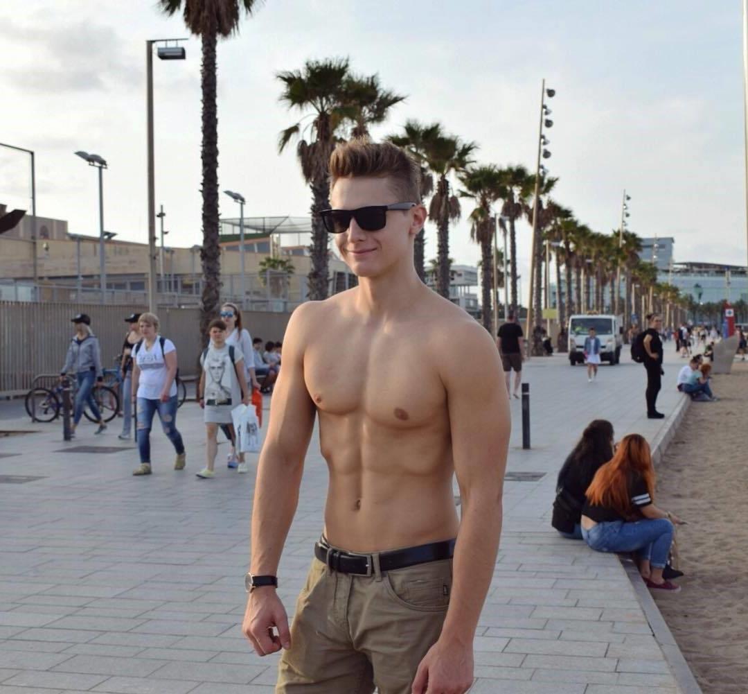 young-teen-college-boy-smiling-shirtless-fit-body-sunglasses