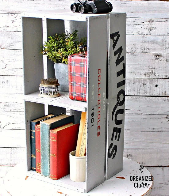 Crate shelf stenciled with Antiques & Collectibles