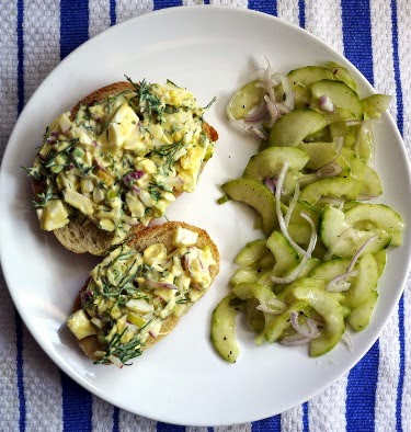 egg salad sandwich with cucumber shallot salad