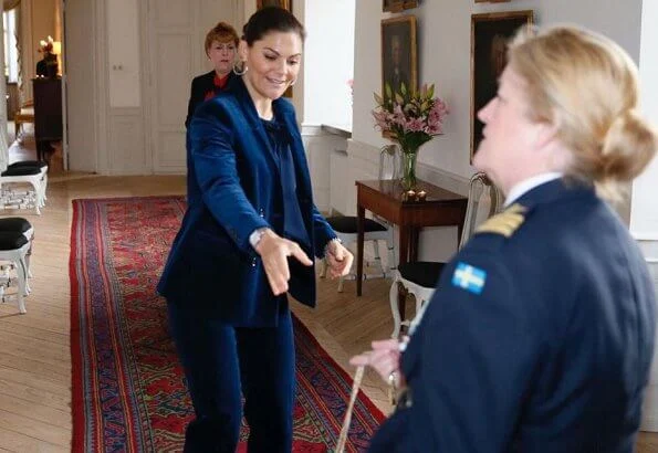 Princess Victoria wore a cord suit by Dagmar, and blue boots by af Klingberg, and pyramid earrings by Sophie by Sophie