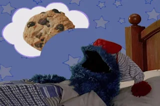 Cookie Monster eats the cookie he saw in his dream. Sesame Street Elmo's World Sleep Quiz