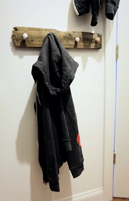 hoodie on pallet wood and drawer knob rack