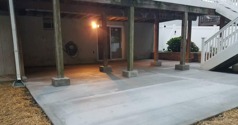 Custom Stoneworks & Design Inc. Concrete Installs. Under deck