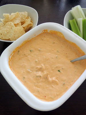 Blue Cheese Buffalo Chicken Dip:  A warm and spicy dip made with cream cheese, sour cream, blue cheese, chicken, and buffalo sauce.