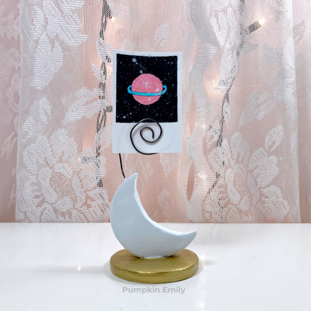 DIY air dry clay moon photo display with a picture in it