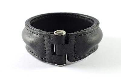 Custom made bracelet one inch wide made in black leather with stainless steel fastening, entirely hand made and hand stitched