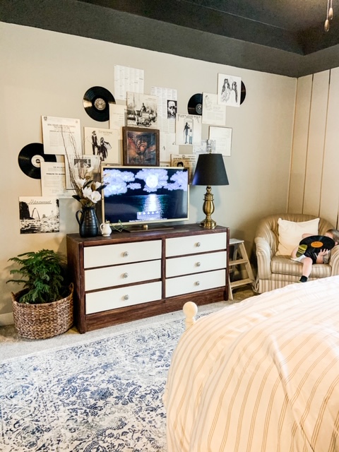 Records on wall above dresser