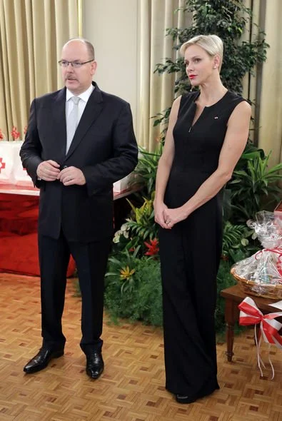 Monaco National Day 2017 christmas gifts ceremony. Princess Charlene wore Akris Stretch Silk Jumpsuit