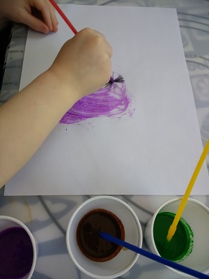 preschooler painting with smelly paint