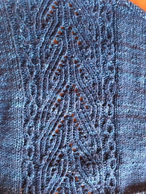 portion of Koru cardigan showing lace detail on back