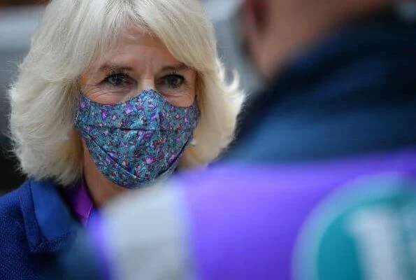 Duchess of Cornwall visited Paddington Station to watch a demonstration by the charity Medical Detection Dogs. blue navy blazer