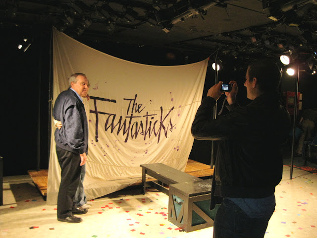 Posing in front of the Fantasticks curtain