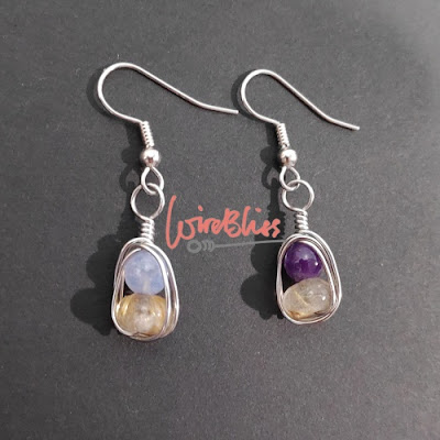 Wire wrapped earrings with moonstones, amethyst and rutilated stones