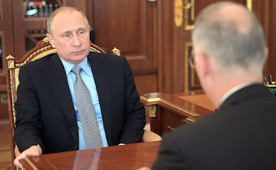 Vladimir Putin at a meeting with Russian Direct Investment Fund CEO Kirill Dmitriev.