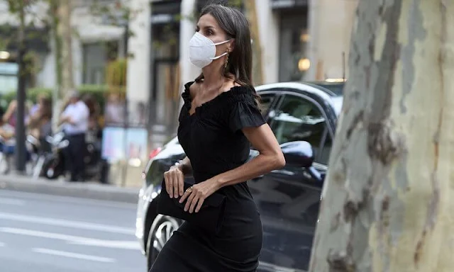 Queen Letizia wore a new Lolita black midi dress by Maria Malo. Sustainable dress. Carolina Herrera suede black pumps