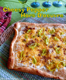 A perfect appetizer for the holiday season, Cheesy Pepper Hors D’oeuvre layers pepper jelly cream cheese with sharp cheddar, pepperoncini and bacon bits. | Recipe developed by www.BakingInATornado.com | #recipe #appetizer