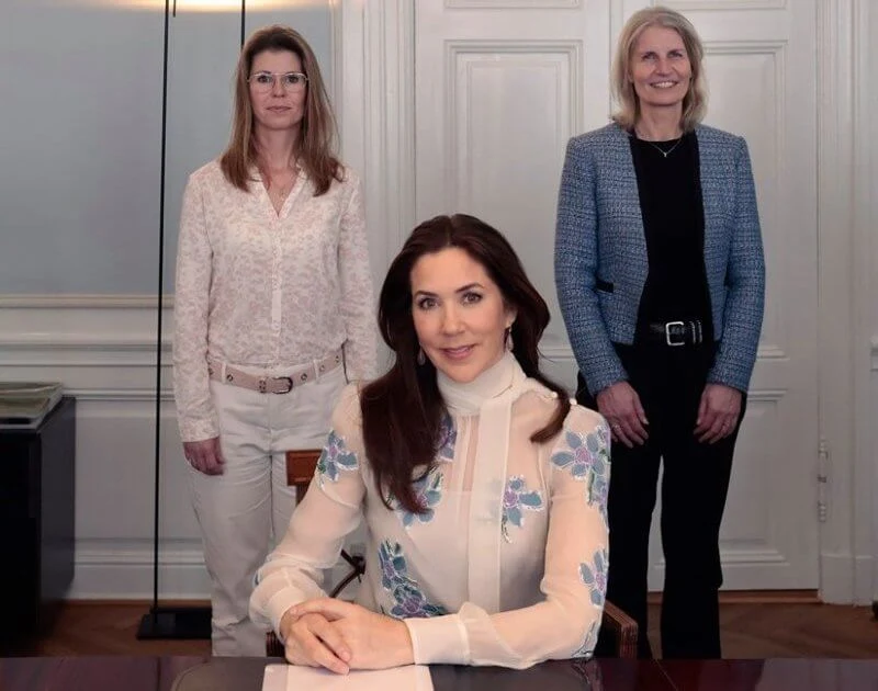 Crown Princess Mary wore a blue floral embroidered pussy bow neckline silk chiffon blouse from Prada