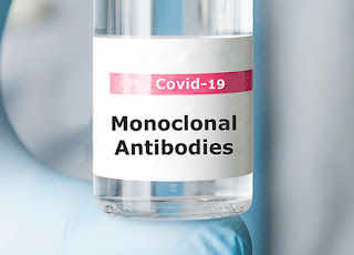 A container labeled COVID-19 Monoclonal Antibodies