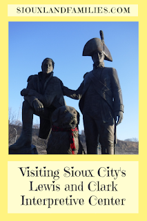 pinnable graphic with words "Visiting Sioux City's Lewis and Clark Interpretive Center" below a photo of a large statue of Lewis and Clark with Lewis' dog Seaman