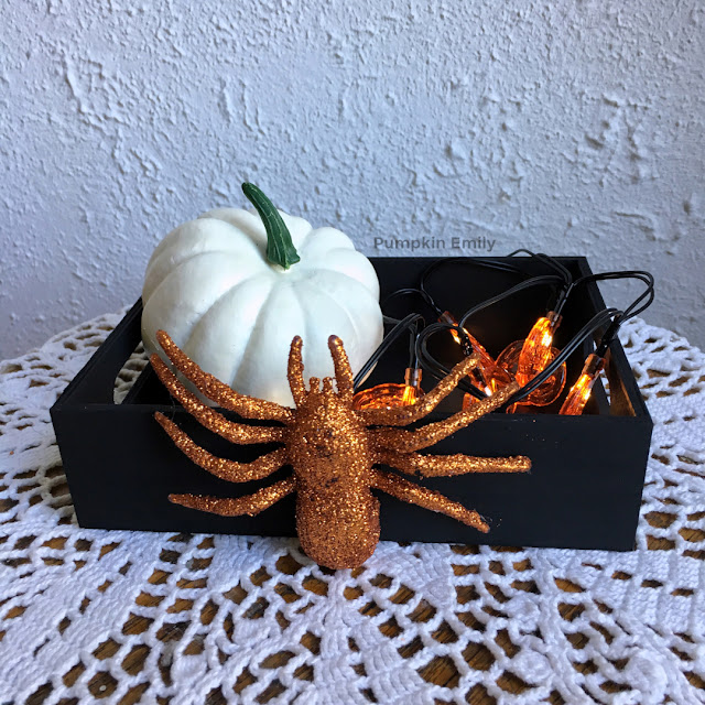DIY wooden tray with a spider on it