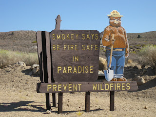 Sign: Smokey Says Be Fire Safe in Paradise. Prevent Wildfires.