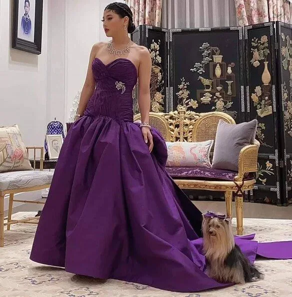 Princess Sirivannavari wore a dark purple Thai silk evening gown designed by herself and which is from her own brand Sirivannavari Bangkok couture