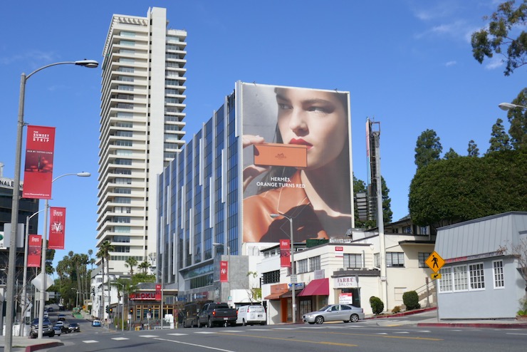 Giant Hermès Beauty Orange turns red billboard Sunset Strip Giant Hermès Beauty Orange turns red billboard