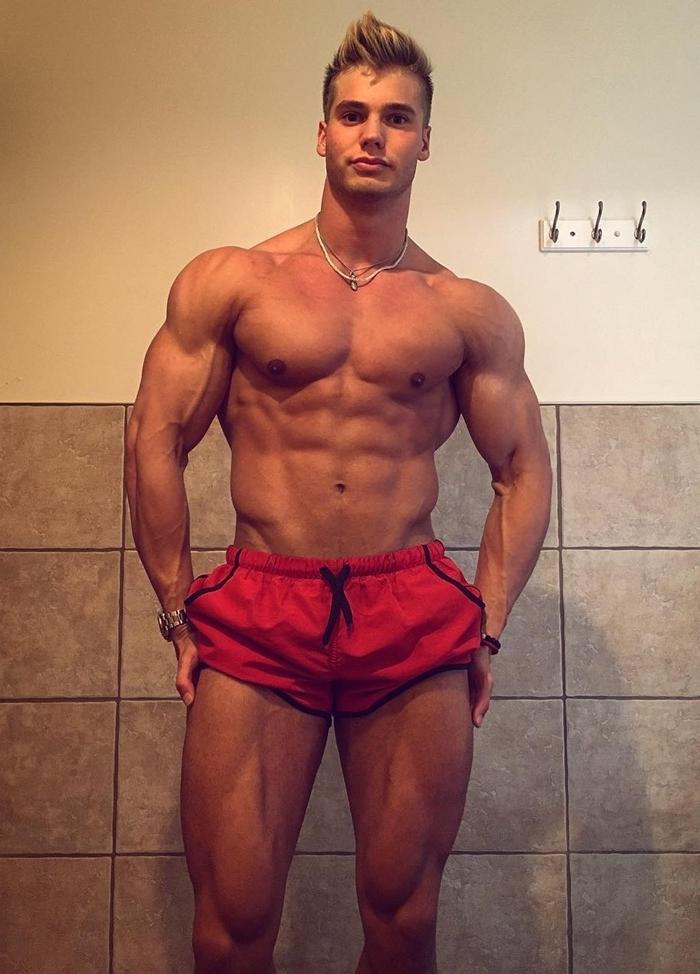sexy-young-bare-chest-muscular-blond-guy-strong-legs-veiny-arms-handsome-face