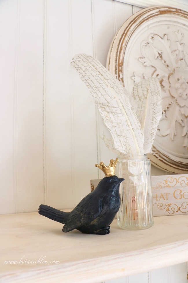 Midnight blue bird with gold crown coordinates with blues found in home and garden shed