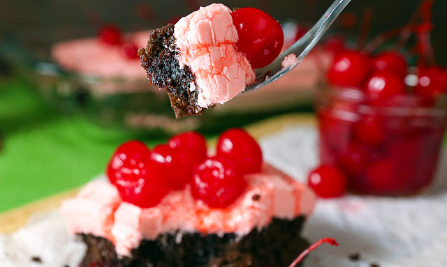 a fork full of cherry chocolate cake
