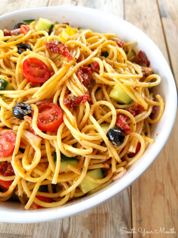 Spaghetti Salad! A unique, delicious overnight pasta salad recipe made with spaghetti noodles, bottled AND dry mix Italian dressing, sundried tomatoes and tons of veggies!